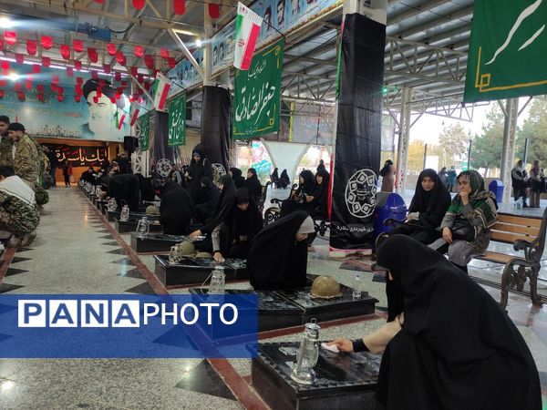 غبارروبی و گلباران مزار شهدای ملارد در رزمایش بزرگ بیت‌المقدس بسیجیان