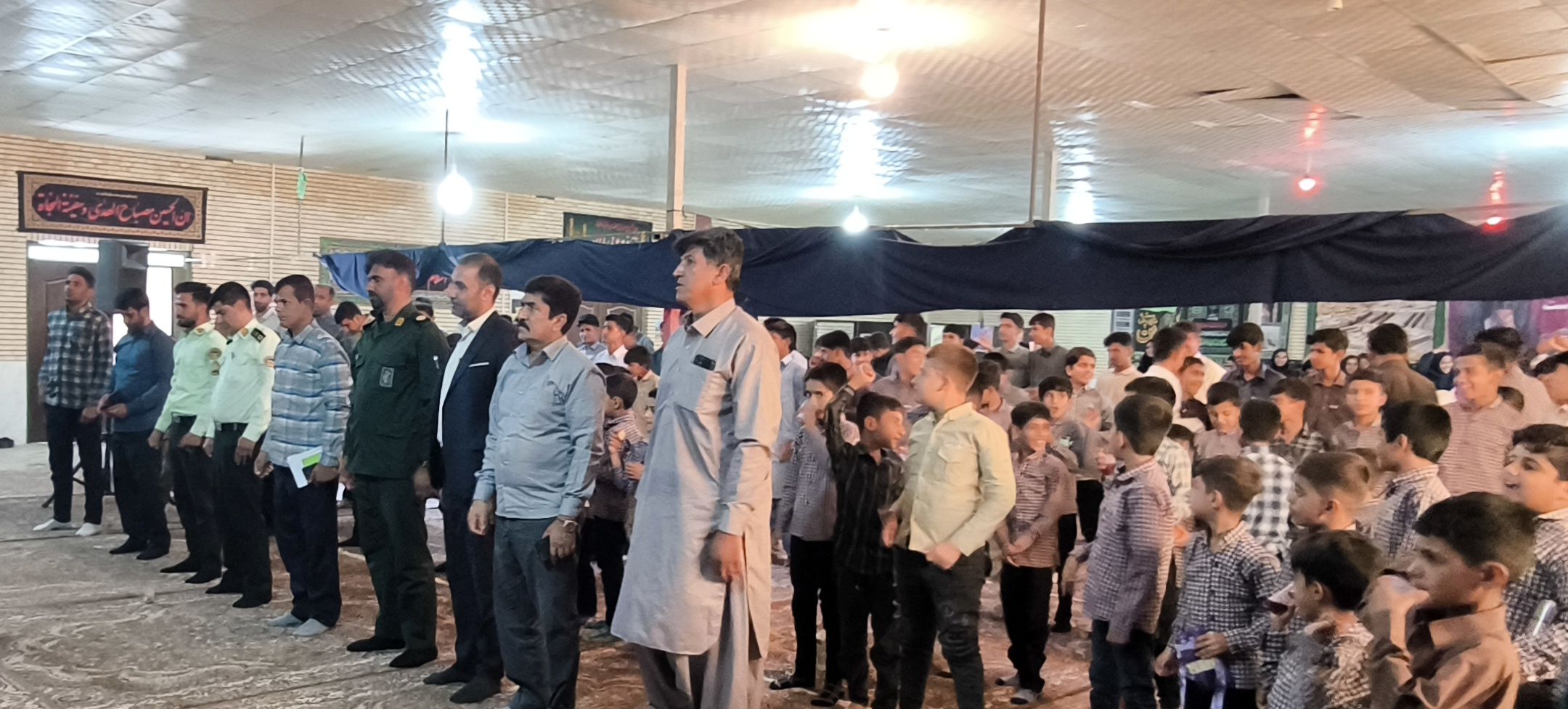 جشن آغاز سال تحصیلی و گرامیداشت هفته دفاع مقدس در حسینیه سیدالشهداء روستای مزرعه شهید بهشتی