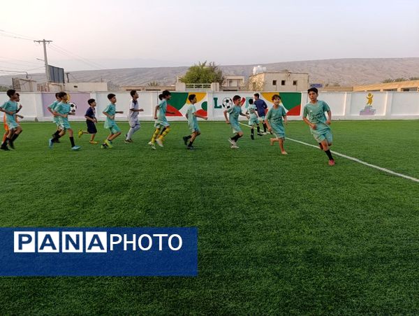 افتتاح زمین چمن مصنوعی آموزشگاه شهید مطهری مارم در فین