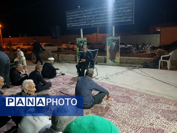 مراسم شبی با شهدا در محل گلزار شهدای روستای بزنجرد شهرستان خلیل‌آباد