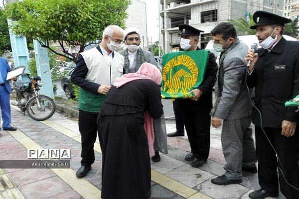 گرداندن پرچم مقدس آستان قدس رضوی در شهرستان محمودآباد