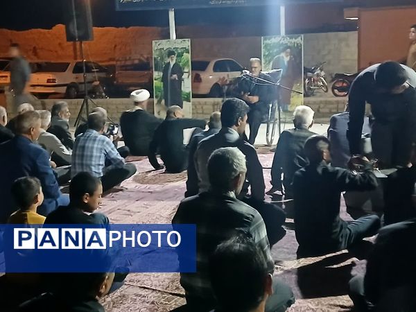 مراسم شبی با شهدا در محل گلزار شهدای روستای بزنجرد شهرستان خلیل‌آباد