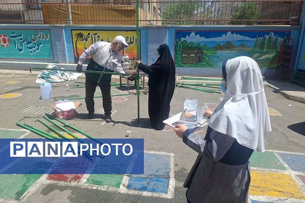 مراسم  پرچم گردانی  بارگاه حضرت علی بن موسی‌الرضا (ع) در مدرسه باهنر ملارد به مناسبت دهه کرامت