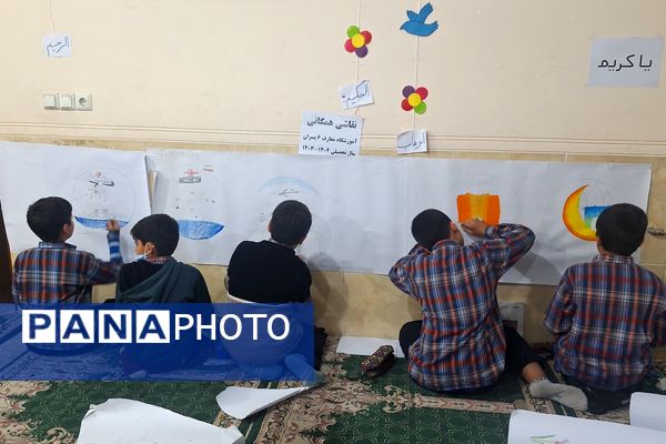 برپایی نقاشی همگانی در هفته ماها در آموزشگاه معارف۶ ناحیه ۳شیراز 