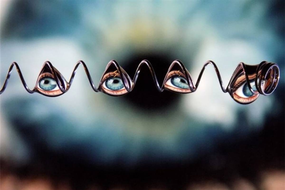 انعکاس تصویر چشم انسان در قطرات آب در عکس روز نشنال جئوگرافیک