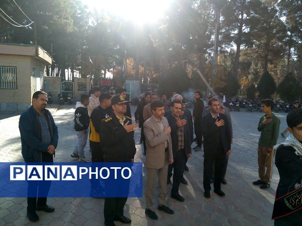 مراسم وداع با شهید گمنام در هنرستان کشاورزی شهید مطهری در شهرستان خلیل‌آباد