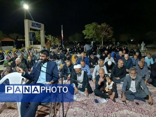 مراسم شبی با شهدا در محل گلزار شهدای روستای بزنجرد شهرستان خلیل‌آباد