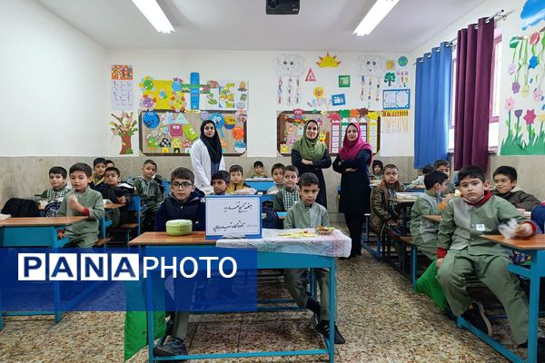 ترویج تغذیه سالم با همکاری سفیران سلامت در مدرسه پسرانه شهید رجایی