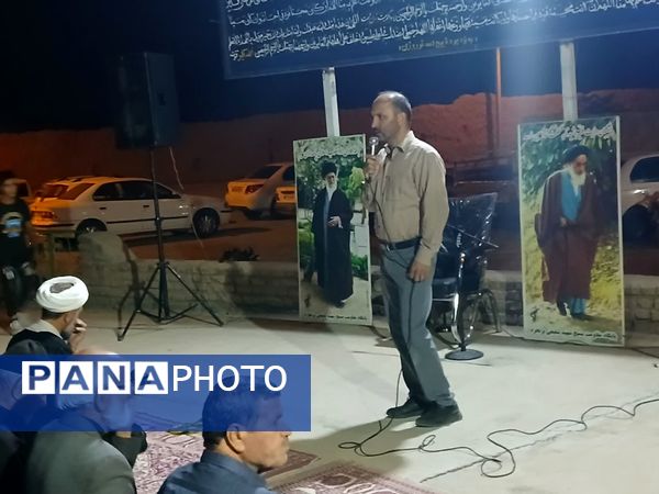 مراسم شبی با شهدا در محل گلزار شهدای روستای بزنجرد شهرستان خلیل‌آباد