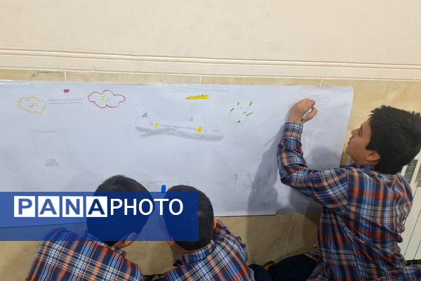 برپایی نقاشی همگانی در هفته ماها در آموزشگاه معارف۶ ناحیه ۳شیراز 