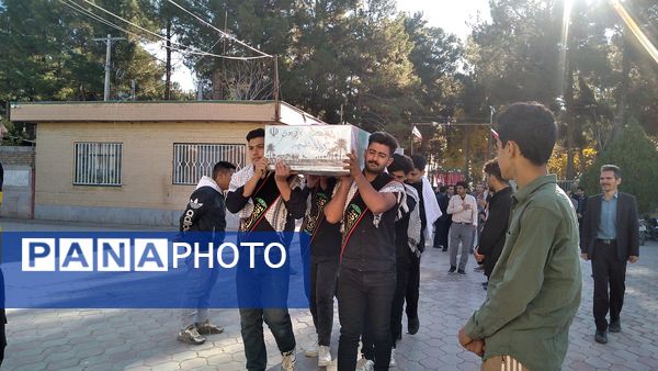مراسم وداع با شهید گمنام در هنرستان کشاورزی شهید مطهری در شهرستان خلیل‌آباد